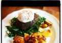 Beefsteak on fresh rocket with poached egg and backed potatoes
